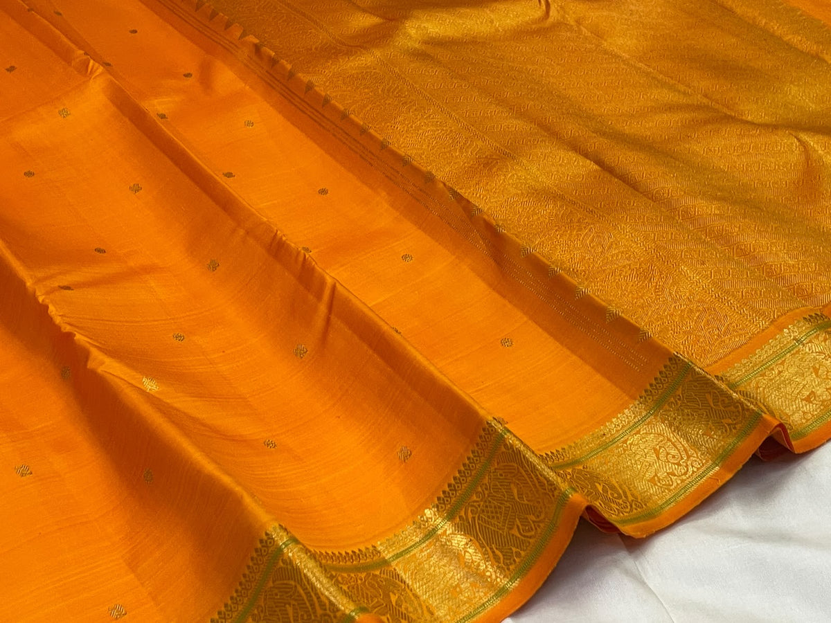 Kesari Orange Handwoven Pure Silk Kanjipuram Butta Saree with Green-Edged Gold Zari Border
