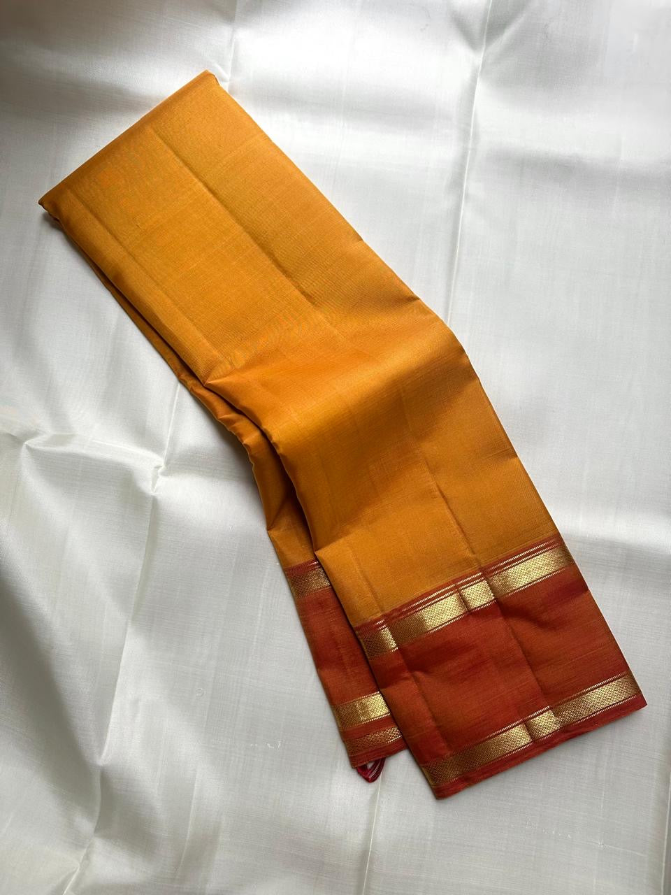 Arakku red Rettapet border with gold zari bands, Manjal orange Kanjeevaram saree