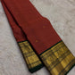 Warm rust Kanjivaram silk saree with traditional gold zari weaving