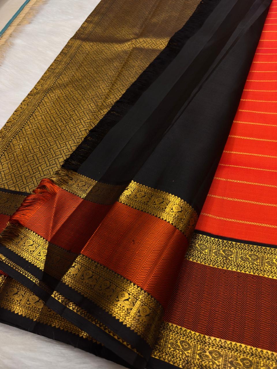 Vermilion Orange Handwoven Pure Silk KanchiPattu Saree with Rettapet Lines and Rust Manthulir Border