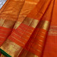Spread pure Kanchipuram silk saree showing gold zari border, striped body and green edge, shipped from New Jersey USA