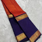Sunset Orange Kanjivaram Rettapet saree with broad navy blue contrast border