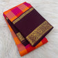Aubergine peacock and Kodi Malar zari border on an orange and Rani pink Kanchipuram saree.