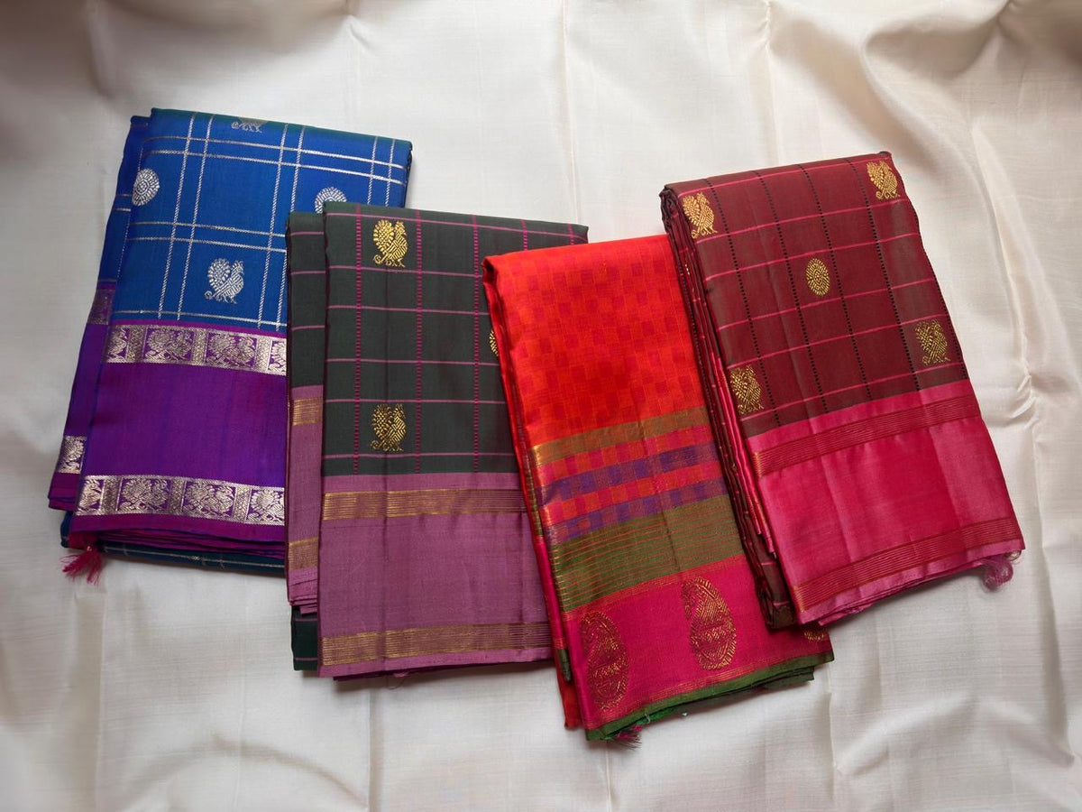 Paimadi kattam body texture on a vivid orange handwoven Pure Silk Kanchipuram saree.