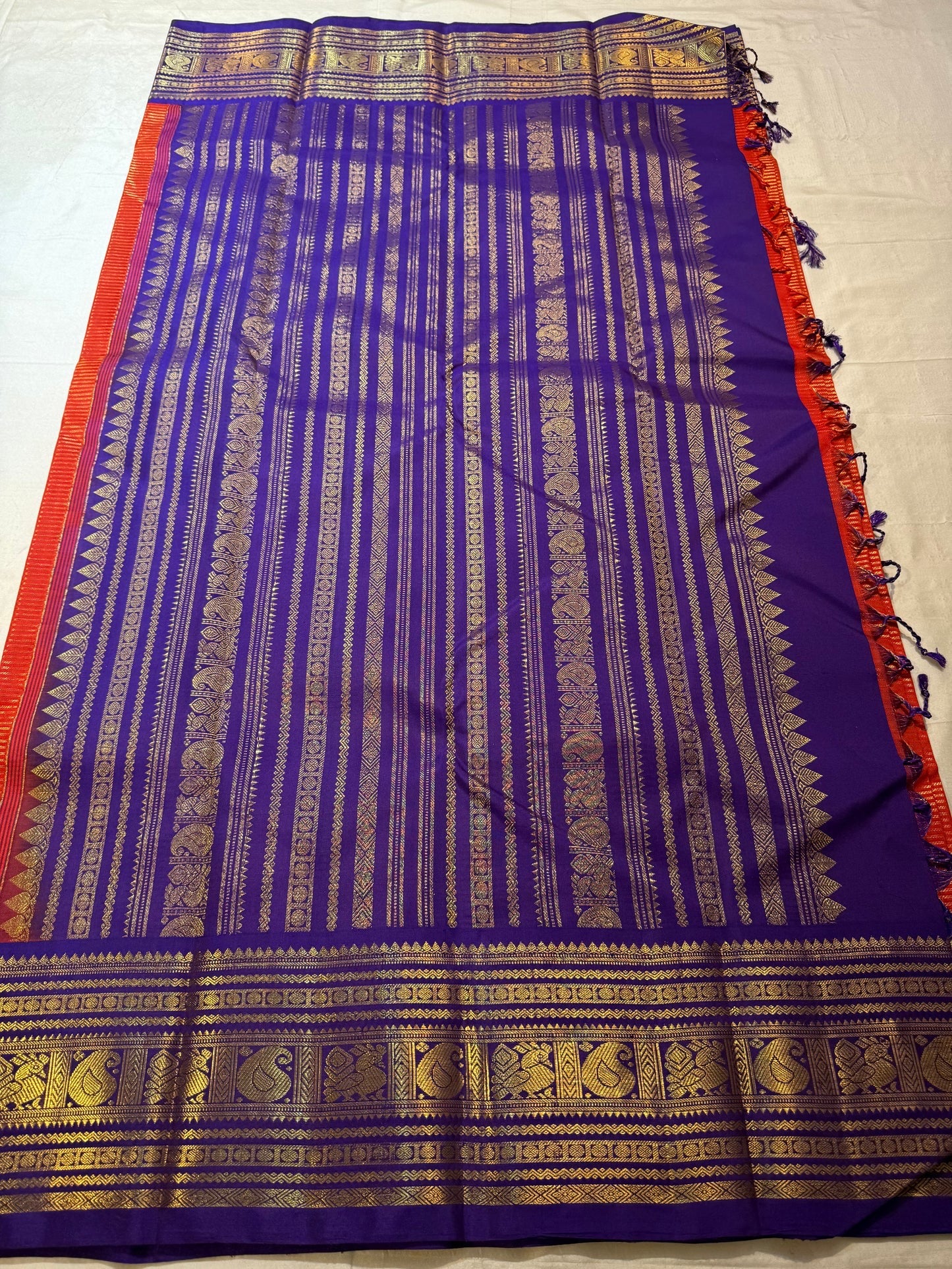 Royal Purple Korvai pallu with antique-gold paisley-shaped zari motifs.