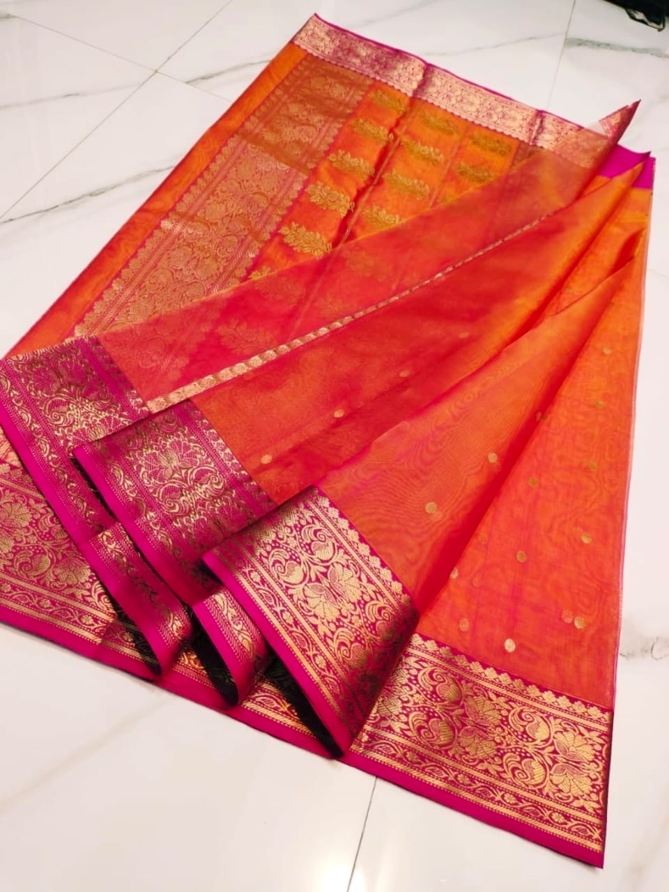 Orange and rani pink handloom Chanderi Katan silk saree, close-up of the silk texture