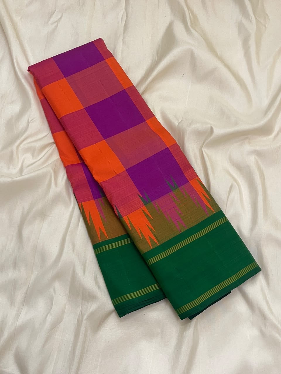 Sunset orange and violet Kanchi Kattam checks on a handwoven pure silk Kanchipuram saree