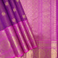Folded orchid pink Vairaoosi Kanchipuram silk with fine zari lines and richly detailed petal pink lotus border