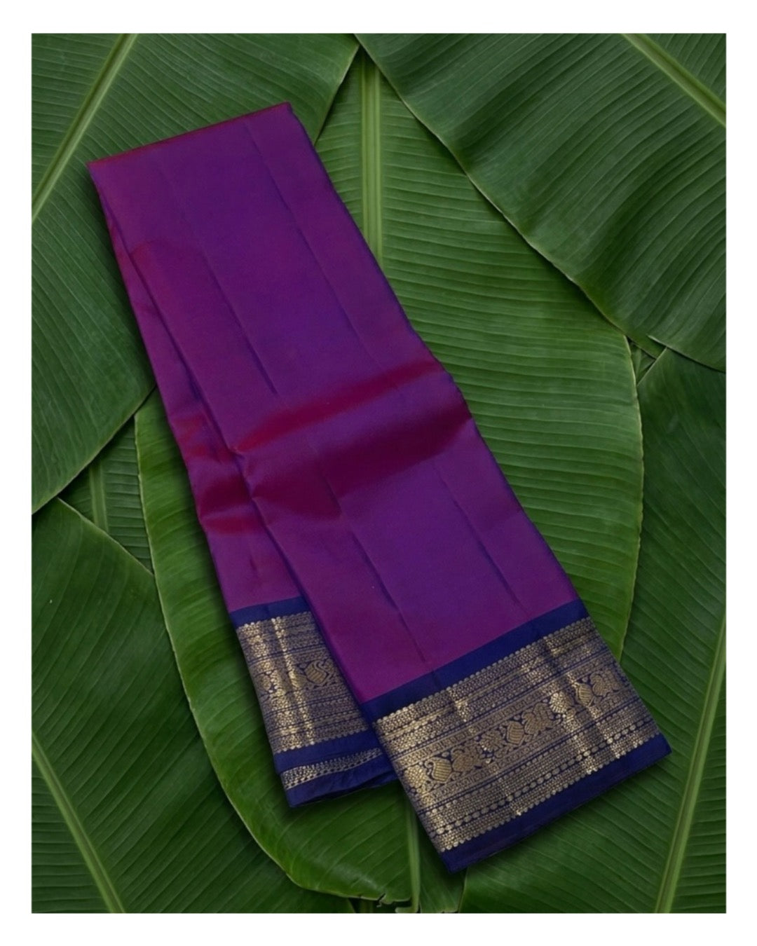 Fuchsia pure silk Kanchipuram saree with compact royal blue varisaipet border close-up — Idam Living