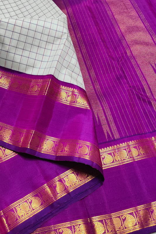 Silver graphite checked Kanchipuram silk saree with orchid pink rettapet border and antique gold zari