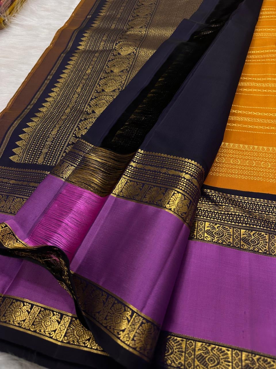Saffron Marigold Handwoven Pure Silk Kanjipuram Korvai Saree with Orchid Purple Border and Veldhari Zari