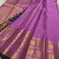 Gold zari border and petite buttas on an orchid-lilac handwoven pure silk Kanchipuram saree