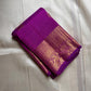 Close view of the orchid purple Kanchipuram saree showing the gold zari border and pallu