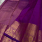 Gold zari border detail on an orchid purple Kancheepuram silk saree
