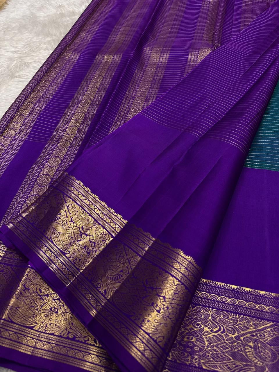 Kanchipattu silk saree in sapphire blue with orchid purple border Double Korvai weave traditional zari detail