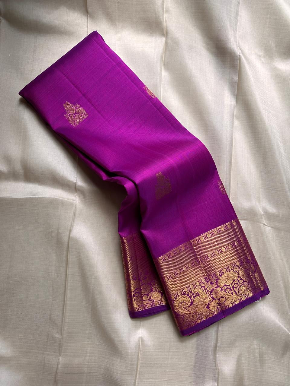 Orchid purple handwoven Pure Silk Kanchipuram korvai saree folded to show the rich zari border