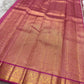 Soft Lotus Pink Kanchi Pattu silk with gold-zari ornament.