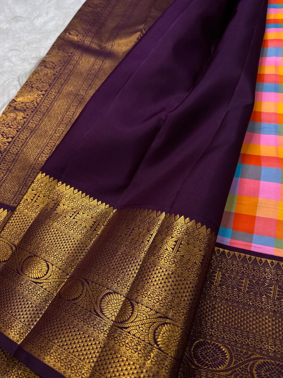 Antique-gold woven pallu with purple floral and linear registers | Kanjipuram pure silk saree.