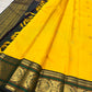 Oversized lotus border on Turmeric Yellow Kanchipuram silk saree - Idam Living