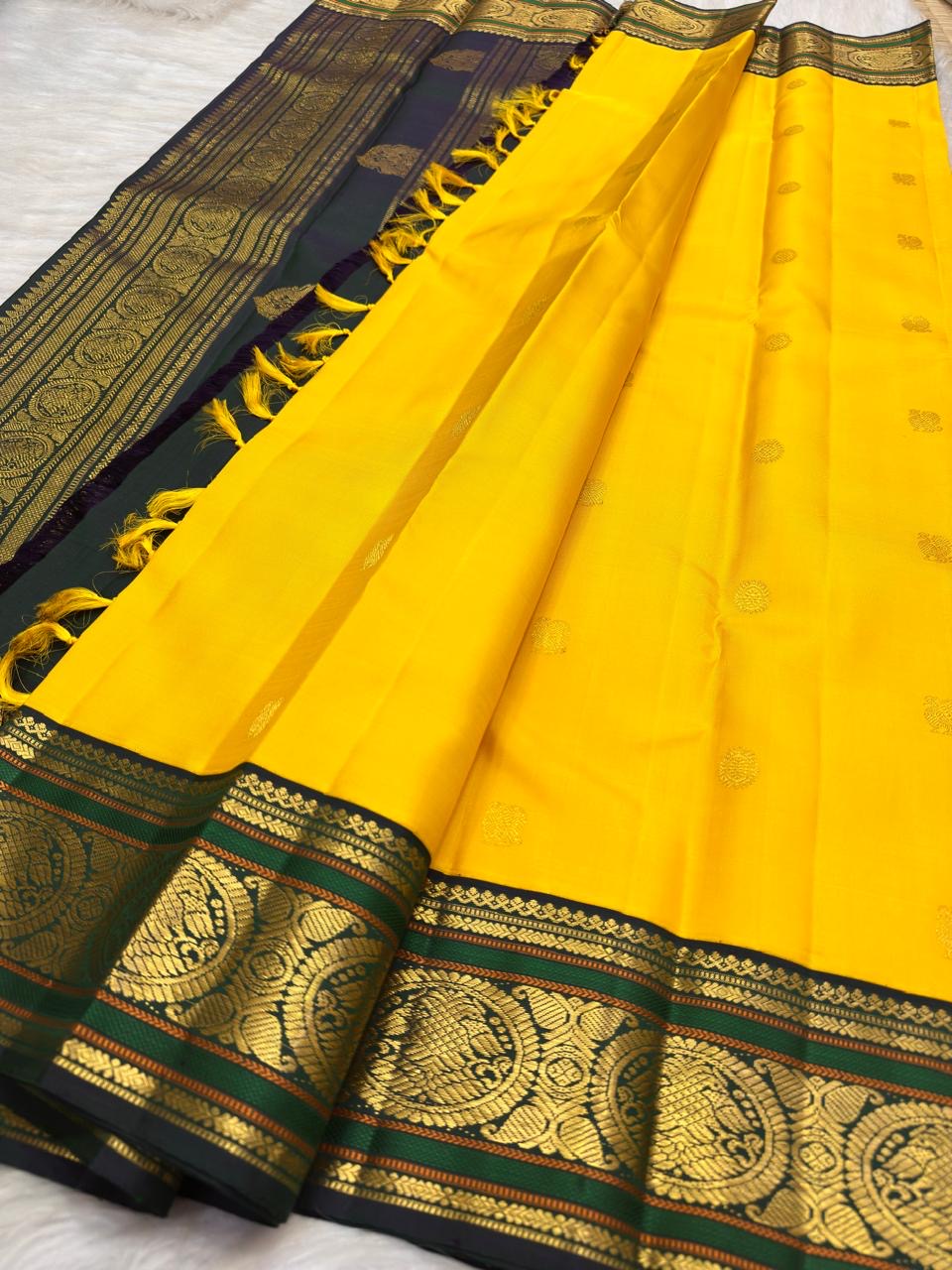 Oversized lotus border on Turmeric Yellow Kanchipuram silk saree - Idam Living