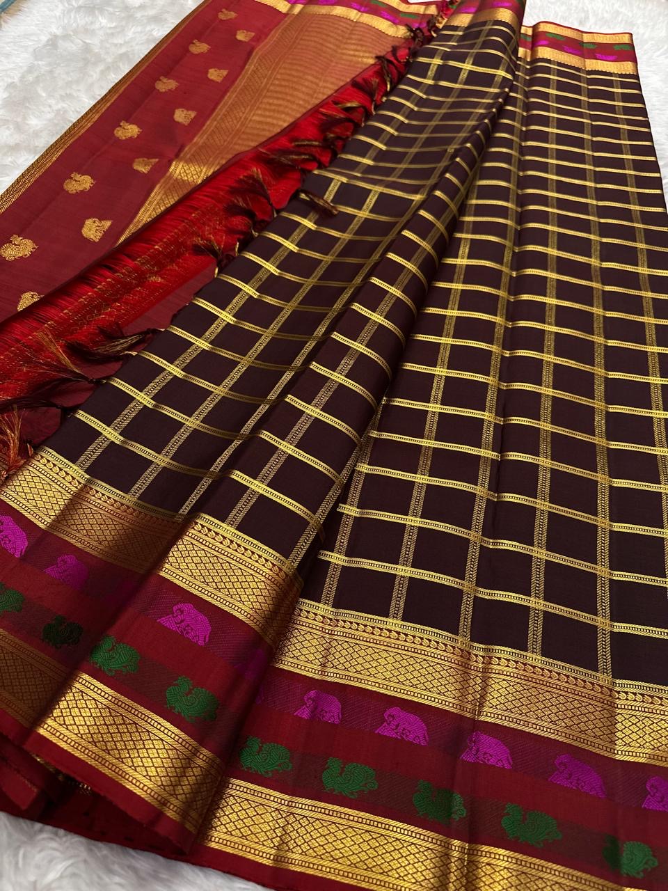 Paaku Brown Pure Silk Kanchipuram with Arakku maroon, magenta pink, green and traditional gold accents.