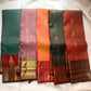 Dense gold-zari lattice mundhanai on the Dusty Mauve-Lilac Kanchipuram saree.