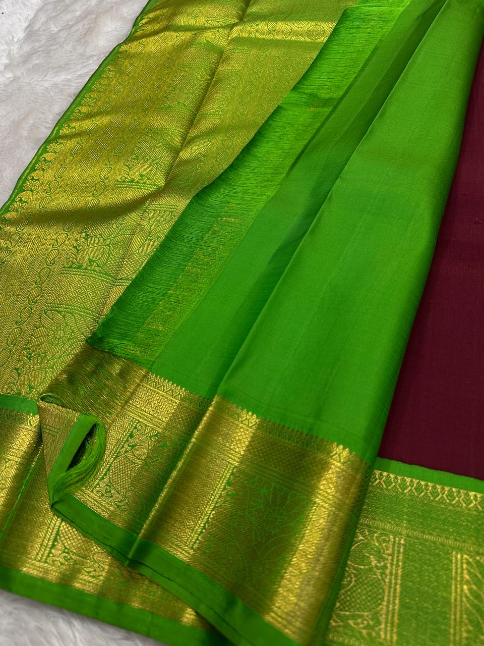 Bright parrot-green Kanchipuram silk border with broad gold-toned woven ornament