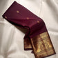 Small classic-gold zari buttas spaced across deep reddish Paaku Brown silk.