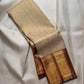 Soft pearl-ivory Kanchipuram silk body with restrained spacing of traditional classic gold zari buttas.