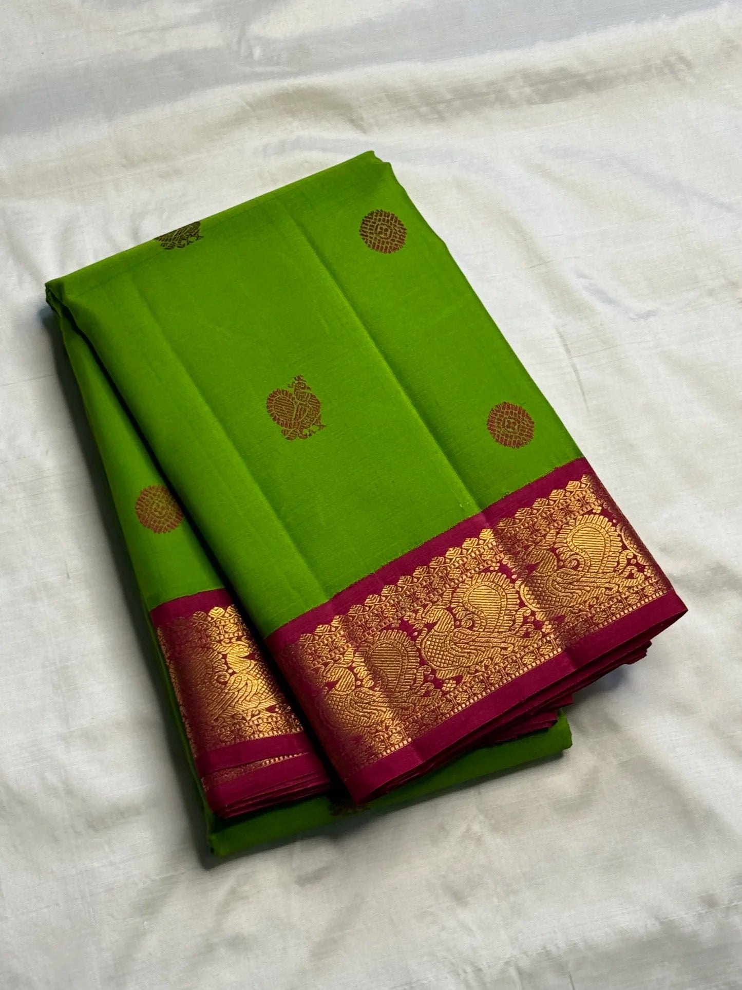 Pachai Green Kanchipuram silk saree with handwoven silk thread buttas