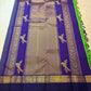 Close view of gold zari buttas on Pachai Green Kanchipuram silk