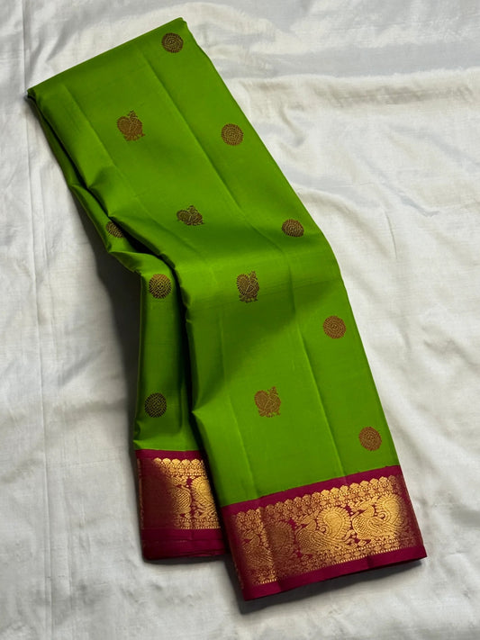 Pachai Green Handwoven Pure Silk Kanjivaram Butta saree with small Deep Magenta border