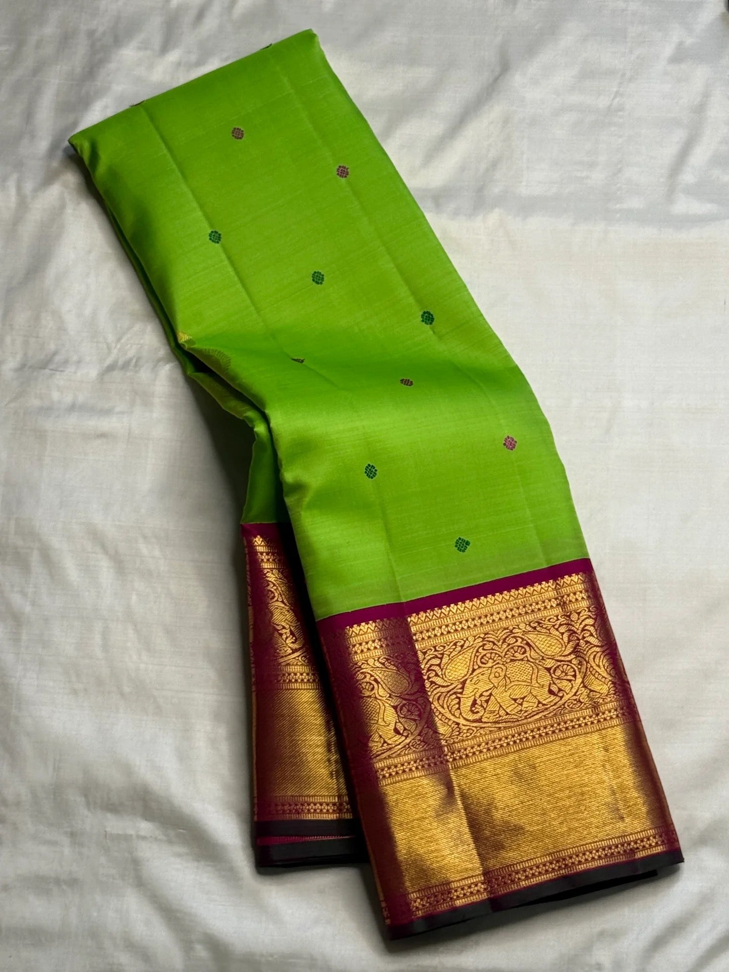 Rani Pink Korvai border with traditional antique-gold Yaanai elephant zari motifs.