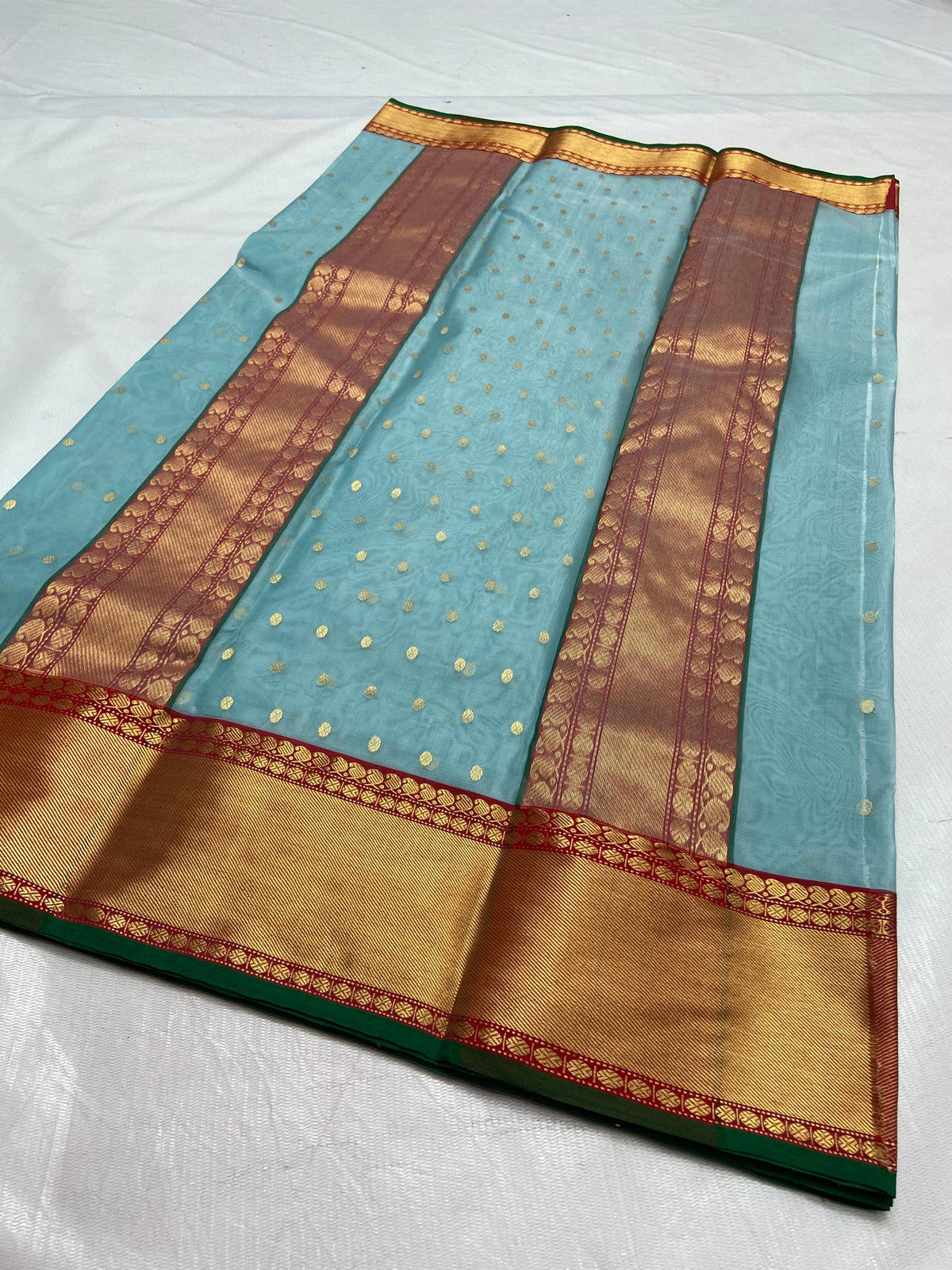 Pale blue Katan Chanderi saree with red and gold border