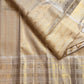 Pale gold handwoven Pure Silk Kanjeevaram Butta saree with orange Meenakari Kamalam motifs and coral-orange selvedge, full saree view