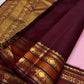 Folded Pale Blush Pink Pure Silk Kanchipuram Korvai saree showing gold zari buttas and deep Aubergine border.