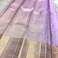 Folded Pale Pink Pure Silk Kanchipuram saree with fine Zari Kattam checks and Mint Green finishing.