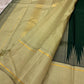 Handwoven Kanjivaram korvai saree in pale sage with thazhampoo reku and pretty buttas