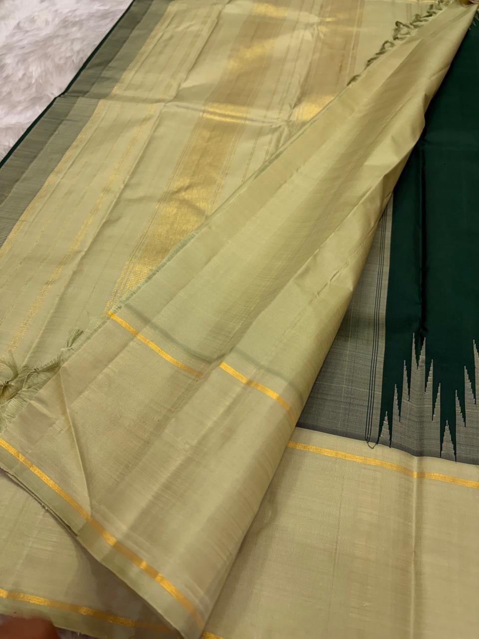 Handwoven Kanjivaram korvai saree in pale sage with thazhampoo reku and pretty buttas
