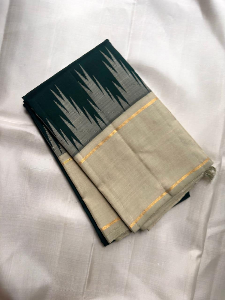 Pale sage Kanjeevaram korvai saree with thazhampoo reku border and antique gold zari