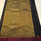 Complete pallu display of Pure Kanchipuram Silk Saree with gold zari honeycomb design, maroon top border, black side checks, and tassel finish (shipped from New Jersey USA)