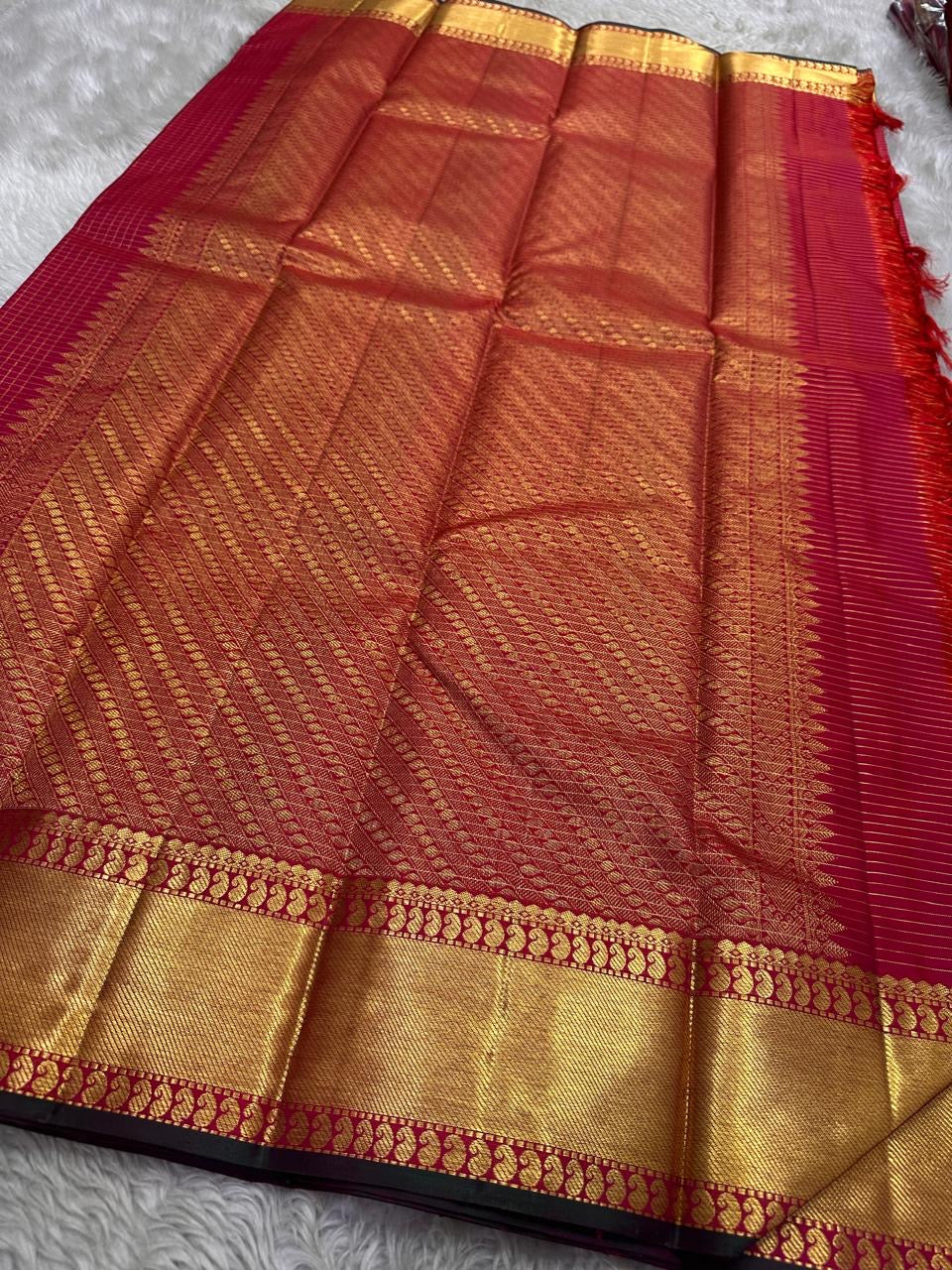 wide gold zari woven border with deep pink body pure kanchipuram silk saree