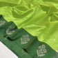 Parrot Green Chanderi silk saree showing silver floral buttas and dark green border with silver woven motifs