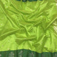 Parrot Green handloom Chanderi saree draped, showing silver floral buttas across the body