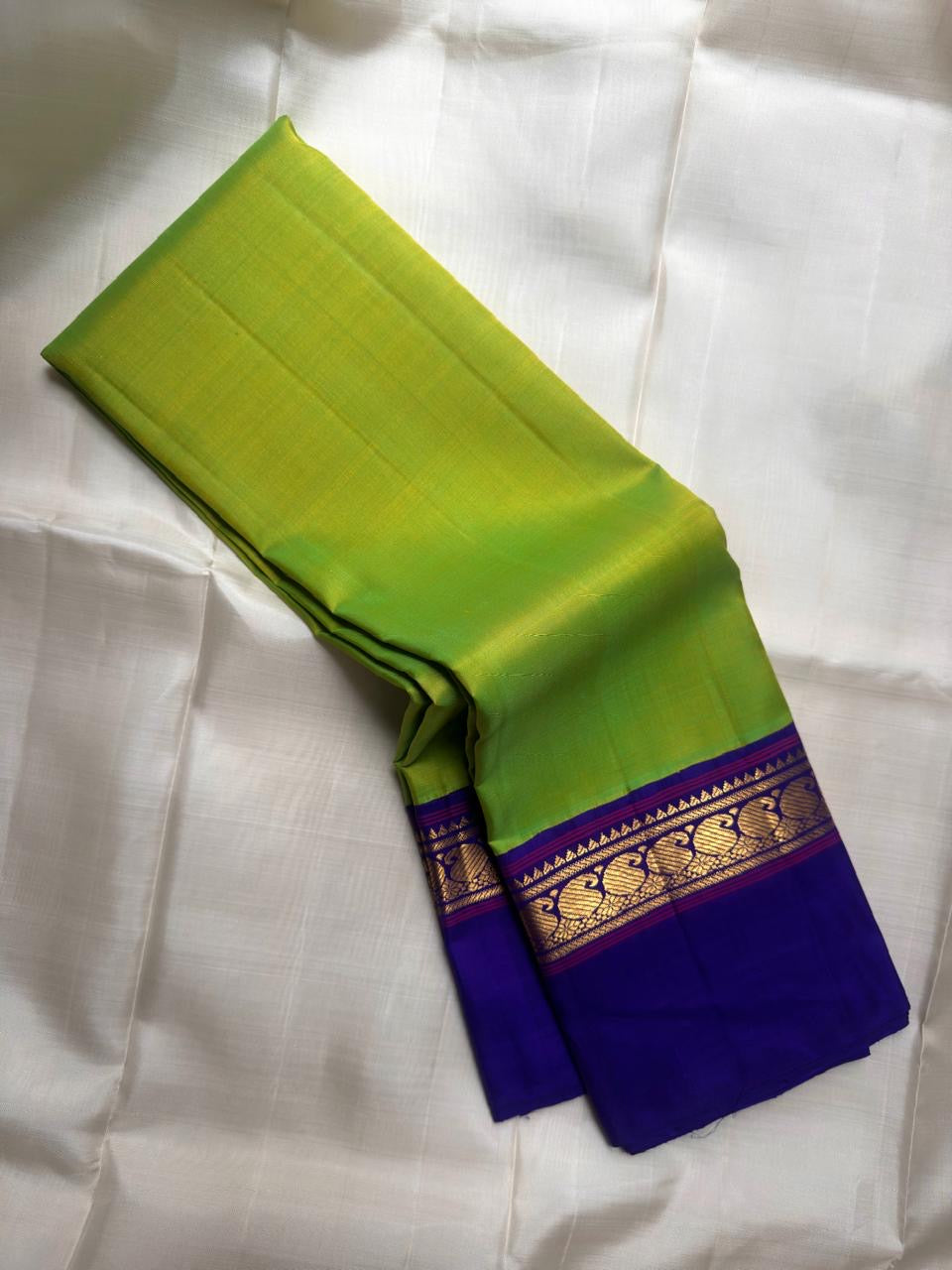 Parrot Green Handwoven Pure Silk Kanchipuram Korvai Saree with Kaal Irangiya Gold Zari Border