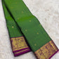 Full view of parrot green handwoven Kanchipuram pure silk saree with zari kattam and mayil border — Idam Living