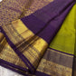 Parrot green Kanchipuram silk saree with Zari Kattam weave and deep purple elephant border — Idam Living