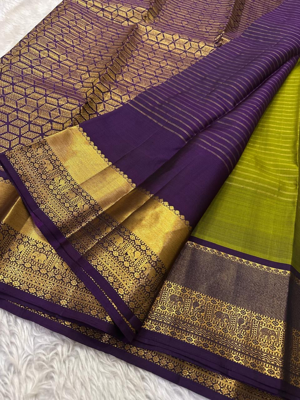 Parrot green Kanchipuram silk saree with Zari Kattam weave and deep purple elephant border — Idam Living