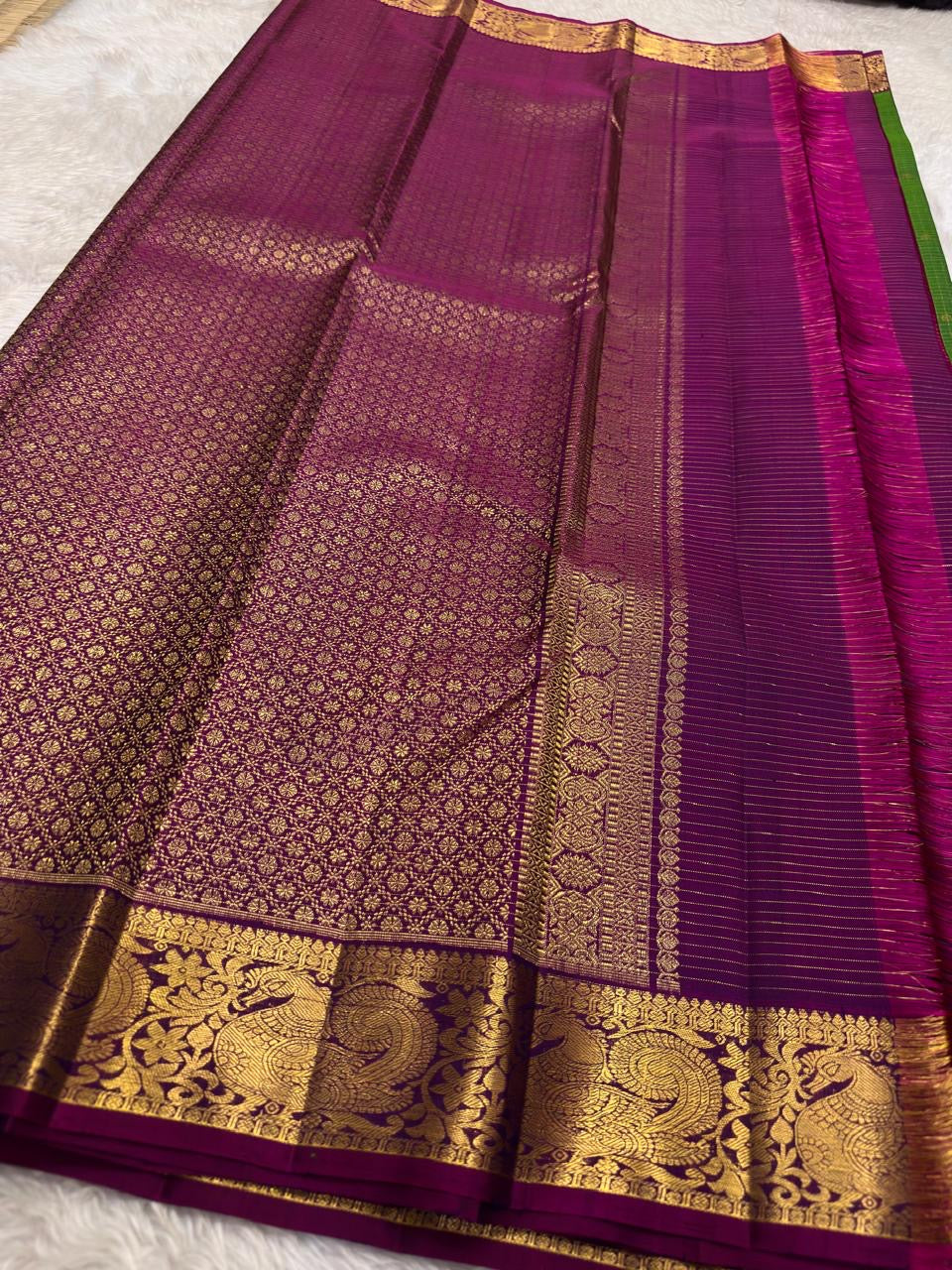Large mayil peacock gold zari border close-up on parrot green Kanjivaram saree — Idam Living