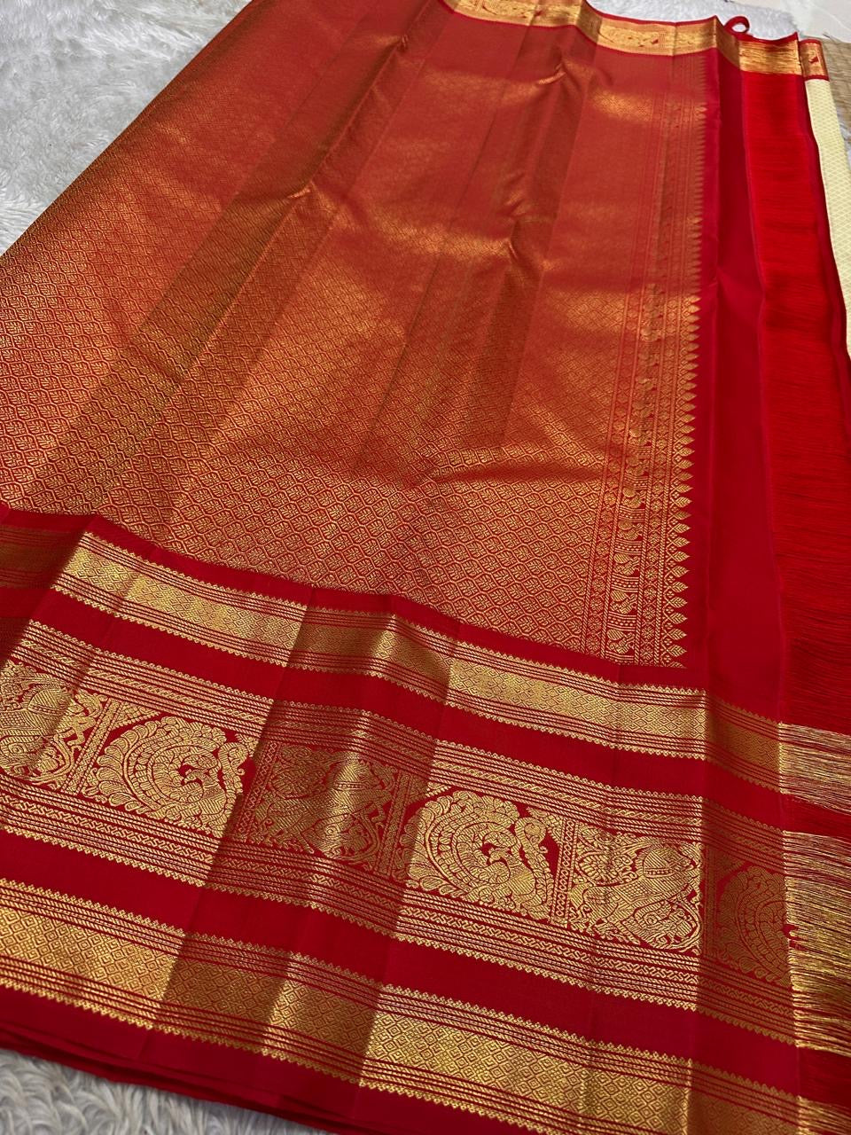 Gold zari Butta Jaal detail — dense all-over motif on parrot green pure mulberry silk Kanjivaram body